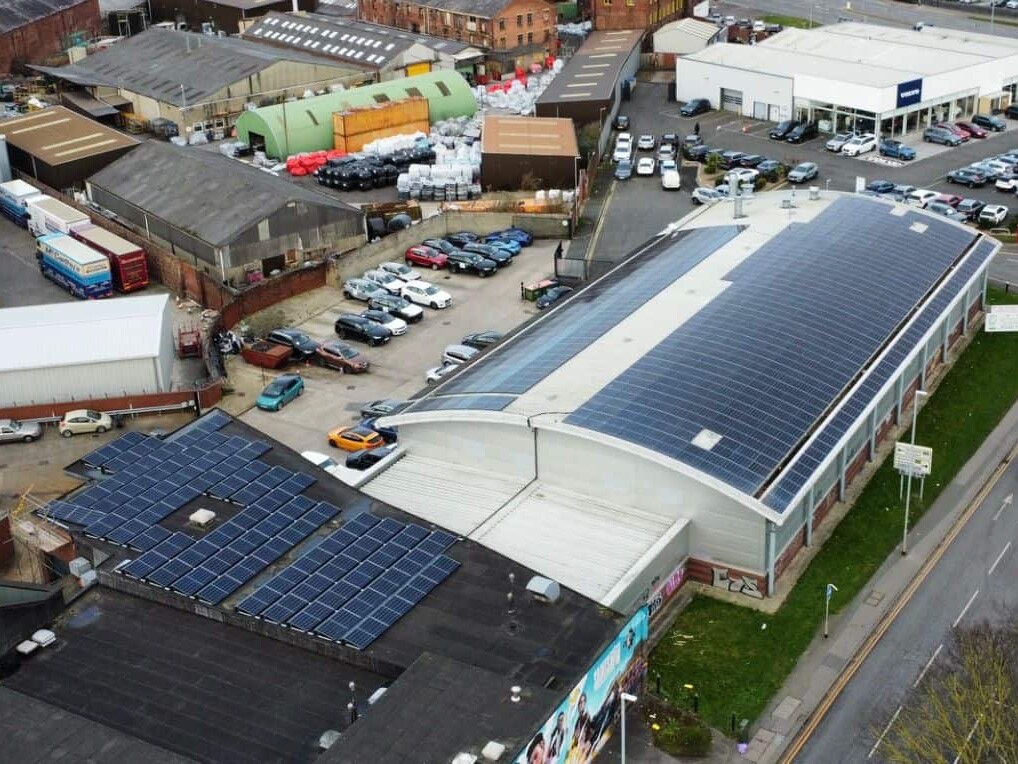A Building With Solar Panels On The Roof