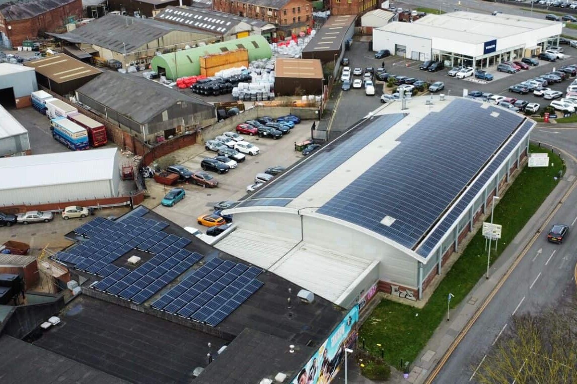 A Building With Solar Panels On The Roof